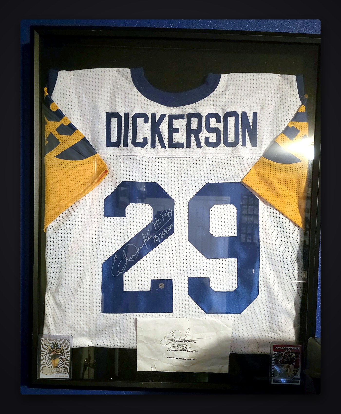 Framed white Los Angeles Rams #29 Dickerson jersey signed in silver, with two Dickerson cards