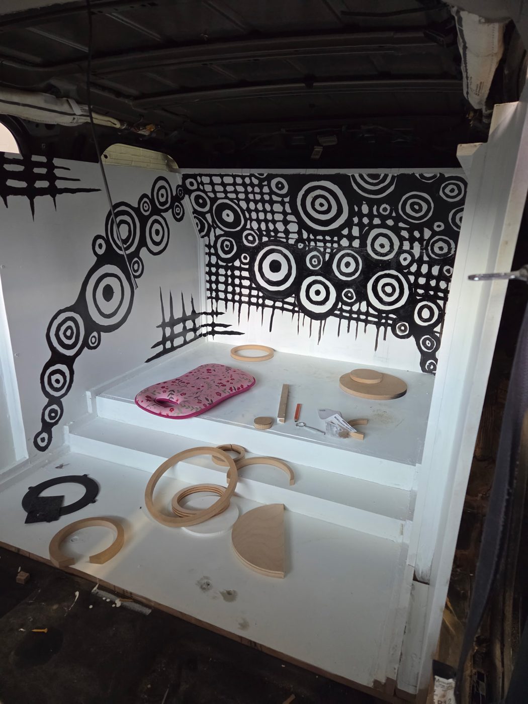 Inside of the cargo area painted white with black circle graphics