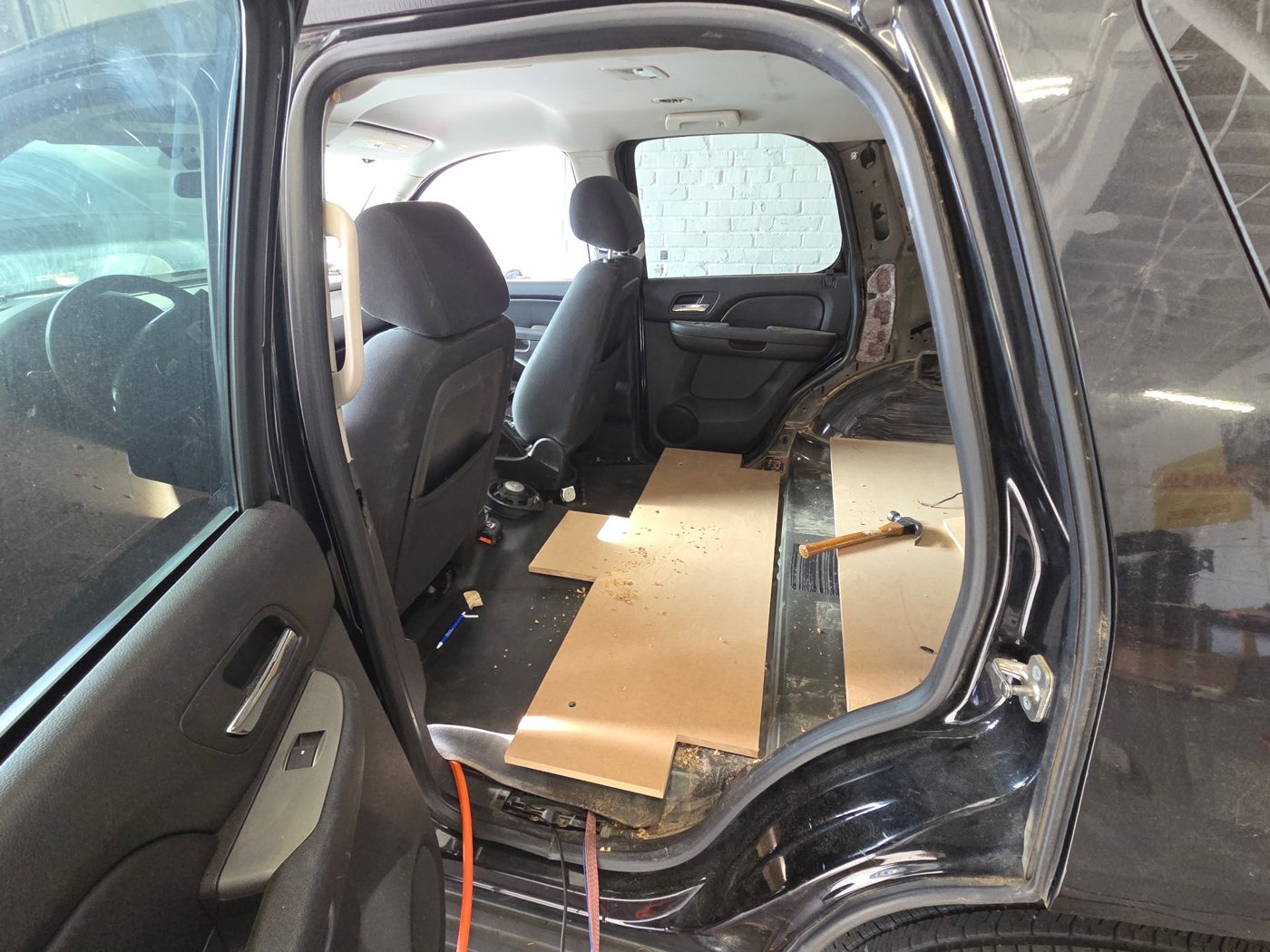 MDF floor panels laid in the Tahoe's second row